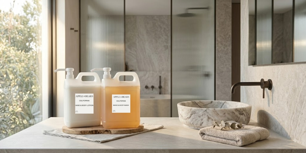 APPLE & BEARS California Hand & Body Lotion and Hand & Body Wash 5 litre refill containers on a marble bathroom countertop